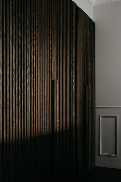 A dark wood slatted cabinet finished with Oil Plus 2C hardwax oil wood finish.