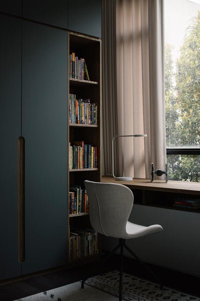 A wardrobe, bookshelf and desk in a kid's room. The desk and wardrobe are finished with Oil Plus 2C in the color "Pure".
