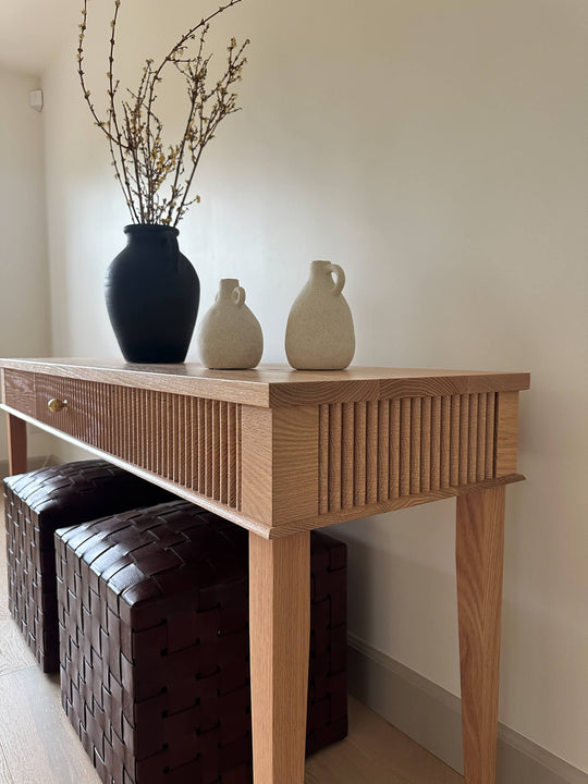 Side angled view of a reeded red oak console table finished with Rubio Monocoat Oil Plus 2C hardwax oil wood finish.