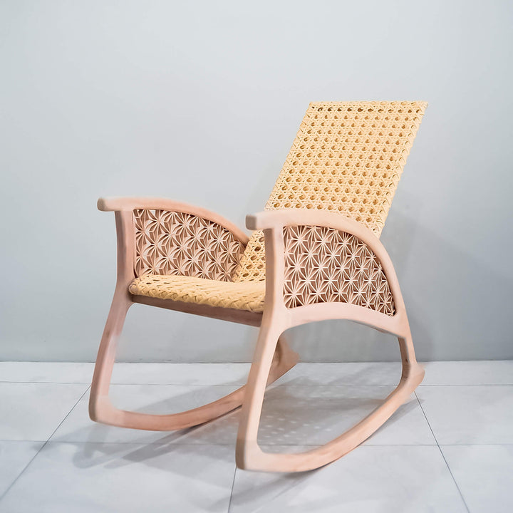 A custom-built mahogany rocking chair with Kumiko details and hand-woven rattan seat and back.
