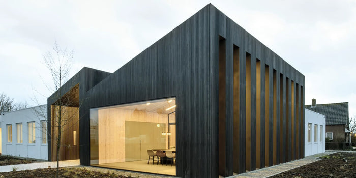 Wood siding treated with Hybrid Wood Protector, an oil-based exterior wood finish.