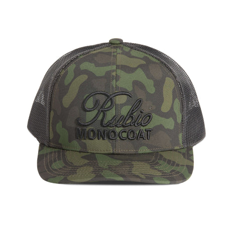 Camouflage cap with Rubic Monocoat logo on a white background