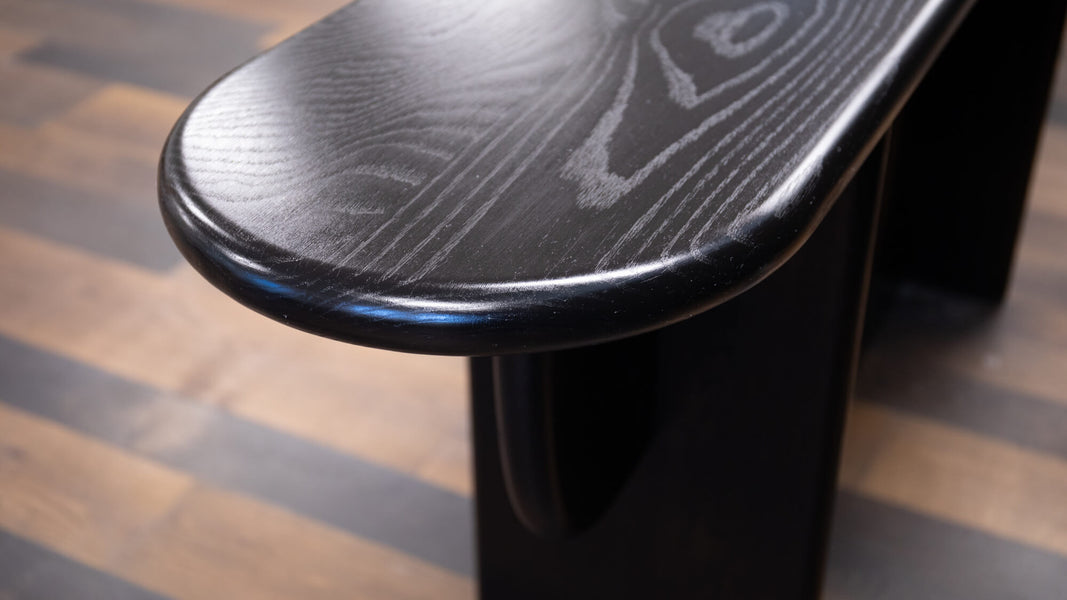 Rounded top on a console table crafted from white oak, stained with Precolor Easy Intense Black, finished with Oil Plus 2C Black, and sheen enhanced with SheenPlus.