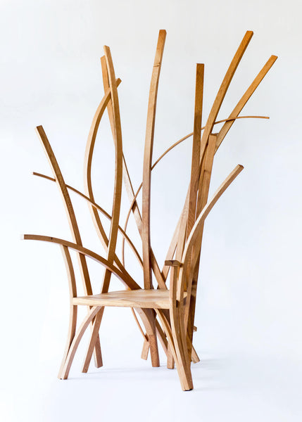 A statement chair made from European oak wood finished with a hardwax oil wood finish.