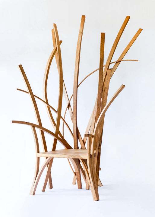 A statement chair made from European oak wood finished with a hardwax oil wood finish.