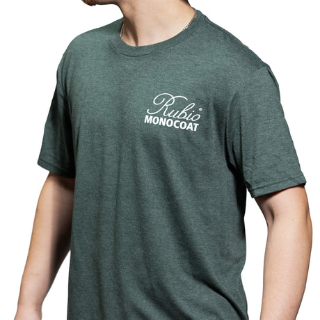 Green t-shirt with 'Rubio Monocoat' logo worn by a person on a white background