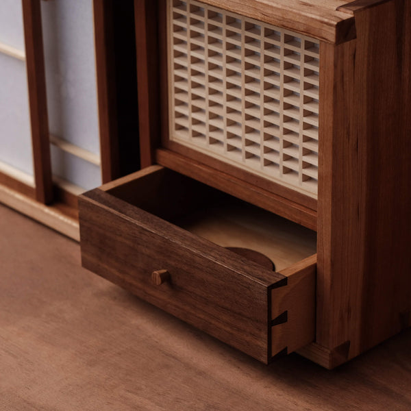 A drawer apart of a mixed wood species tea cabinet finished with a hardwax oil wood finish for interior use. 