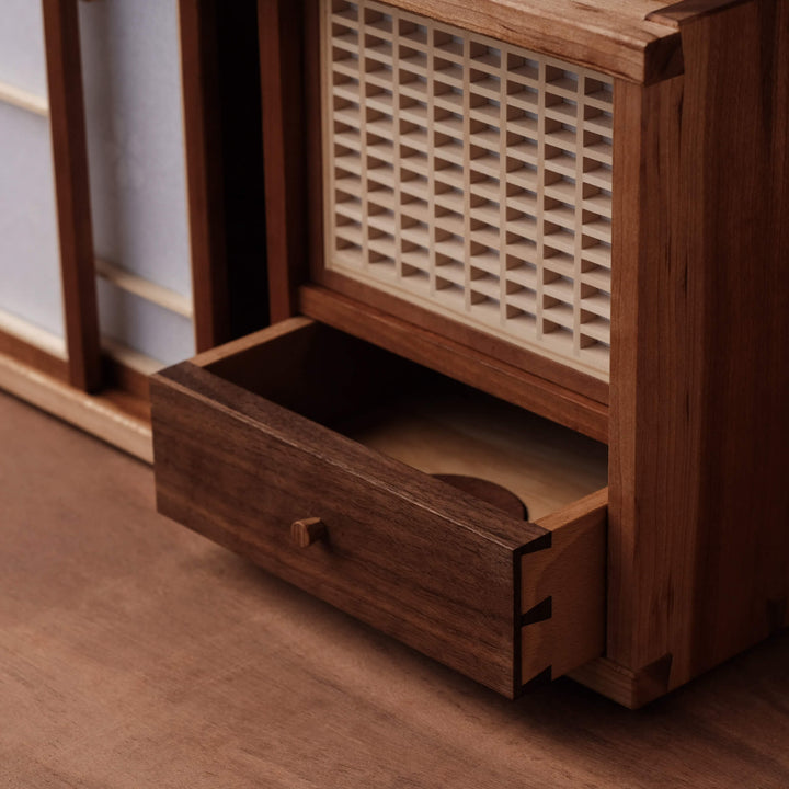 A drawer apart of a mixed wood species tea cabinet finished with a hardwax oil wood finish for interior use.
