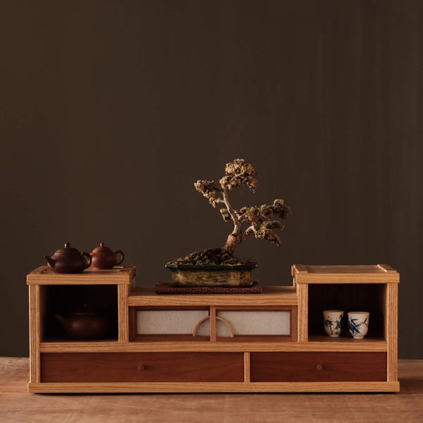 A beautiful handmade ash and cherry tea cabinet with various tea accessories finished using a durable interior hardwax oil wood finish, Oil Plus 2C.