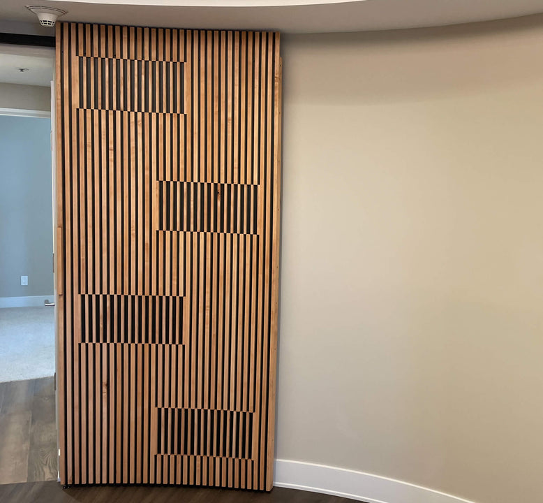 A modern slatted wood door finished with Rubio Monocoat Oil Plus 2C.