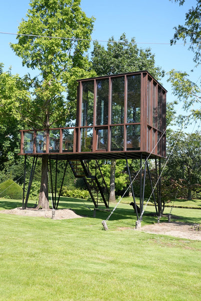 DuroGrit in the color "Bison Brown" was used to finish this modern wooden tree house. 