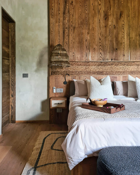 A modern safari-inspired bedroom featuring European Oak millwork finished with Rubio Monocoat Oil Plus 2C "Black".