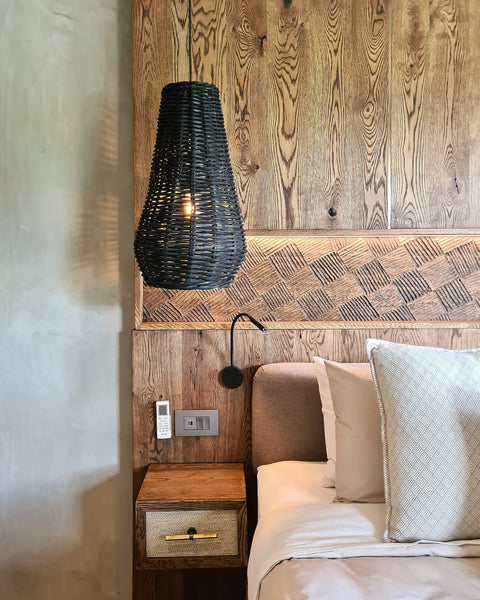 A bedroom featuring European Oak paneling with a unique carved detail finished using Rubio Monocoat Oil Plus 2C in the color "Black".