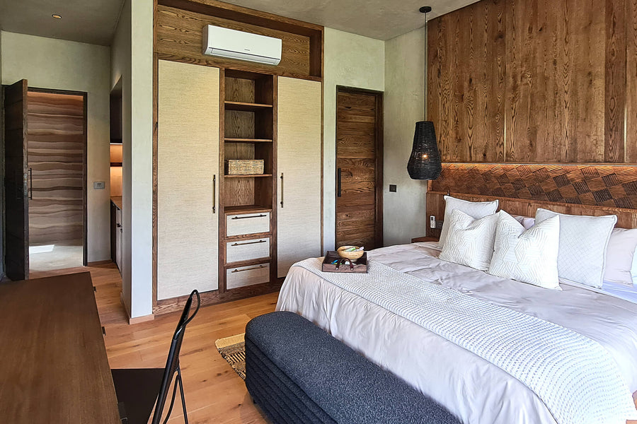 This safari-inspired bedroom features many natural details. The oak wall paneling, millwork, and cabinetry was finished using Rubio Monocoat Oil Plus 2C in the color "Black".
