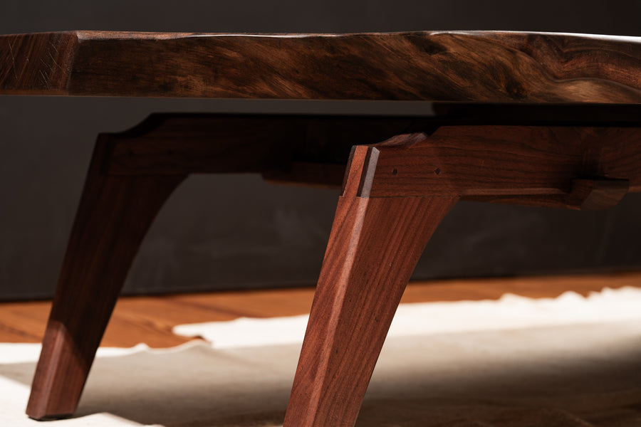 Close up on the leg joinery of a walnut live edge coffee table finished with Oil Plus 2C hardwax oil. 