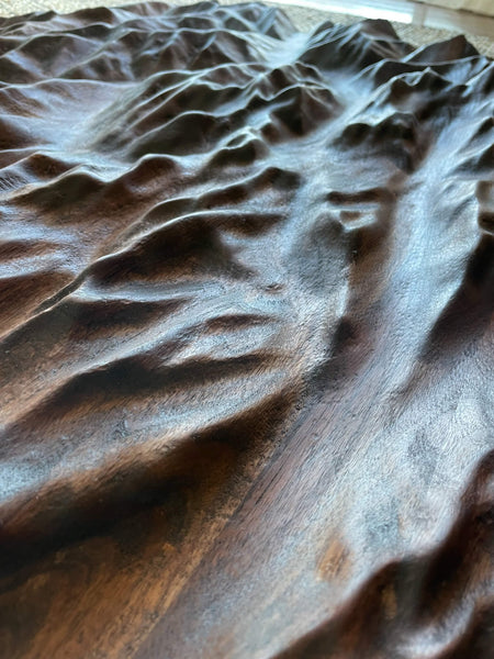 A walnut topographic map detail shot finished with Rubio Monocoat Oil Plus 2C. 