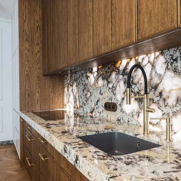 A minimalist kitchen featuring oak cabinetry finished with Rubio Monocoat Oil Plus 2C hardwax oil wood stain and finish.