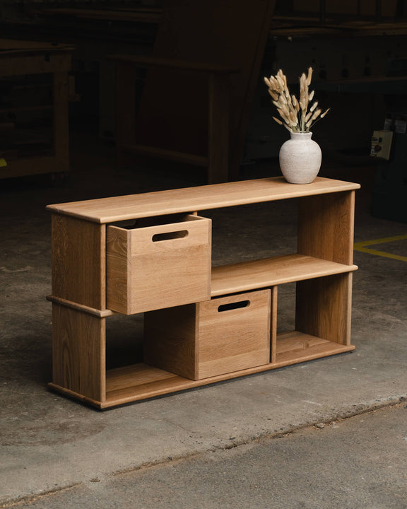 White oak bookcase styled with a ceramic vase and dried pampas grass, featuring removable storage cubes and a Rubio Monocoat Dunes hardwax oil finish.