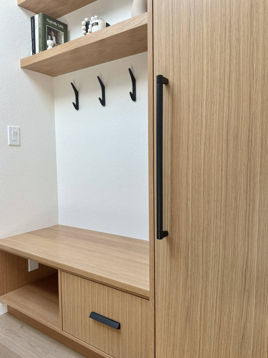 Close up of white oak cabinetry hardware. The wood was finished with Rubio Monocoat Oil Plus 2C "Dunes" a hardwax oil wood stain and finish in one for interior wood projects.
