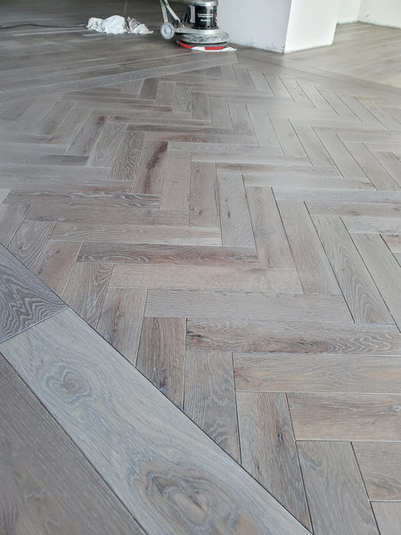 Herringbone cerused wood floor finished with Oil Plus 2C.
