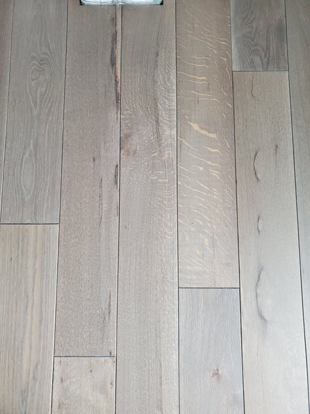 A detail shot of cerused white oak flooring finished with Rubio Monocoat Pre-Aging and Oil Plus 2C.