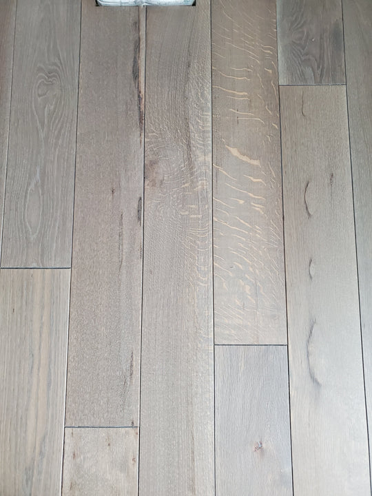 A detail shot of cerused white oak flooring finished with Rubio Monocoat Pre-Aging and Oil Plus 2C.