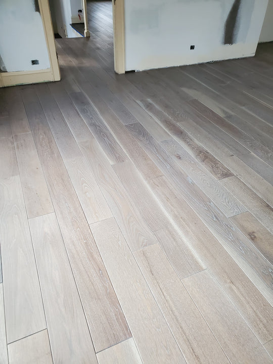 Light colored cerused wood flooring finished with Rubio Monocoat products.