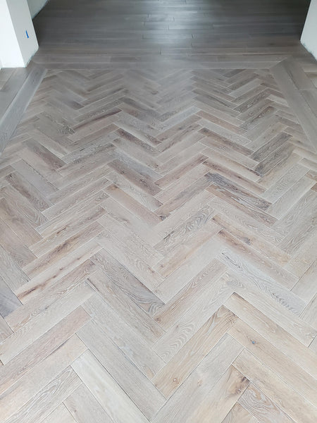 Herringbone white oak wood flooring with plain sawn number 1 grade finished with Rubio Monocoat wood finish products. 