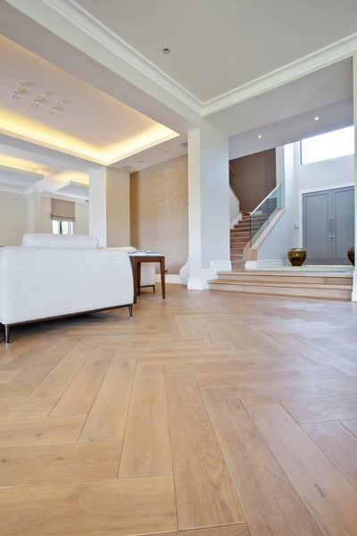 White oak herringbone floor finished with matte hardwax oil wood finish.