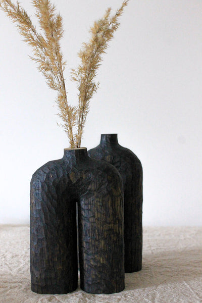 Two wooden vases that were hand carved from white ok and finished with Rubio Monocoat Oil Plus 2C.