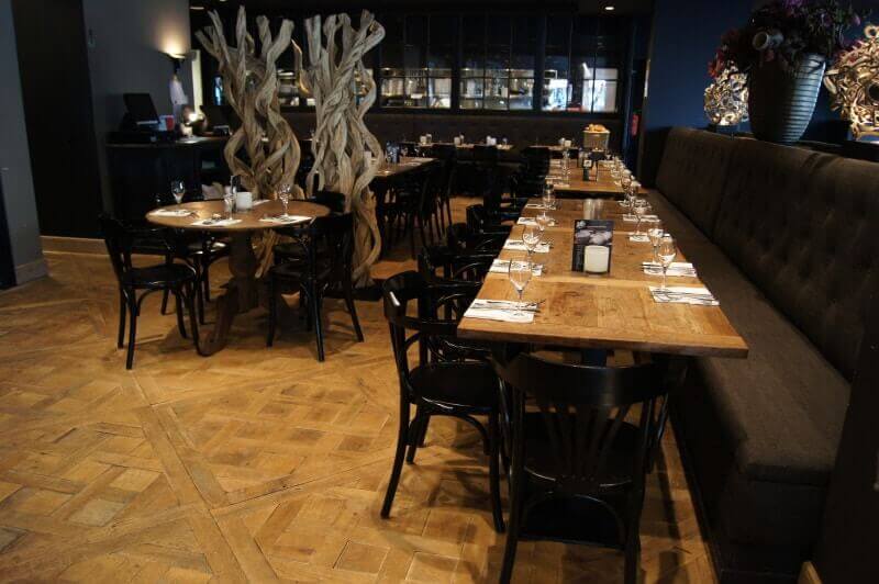 Restaurant in Belgium features wood flooring and furniture finished with Rubio Monocoat.