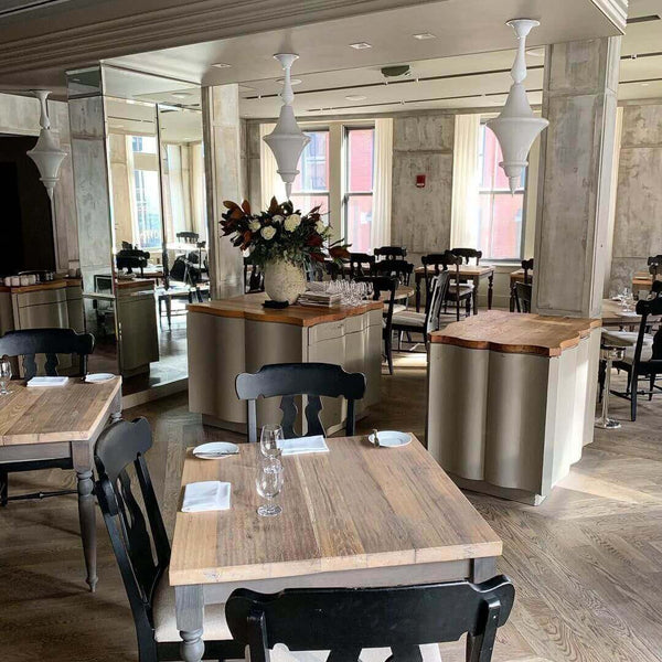 Wooden tables finished with Rubio Monocoat to match the wooden floors.