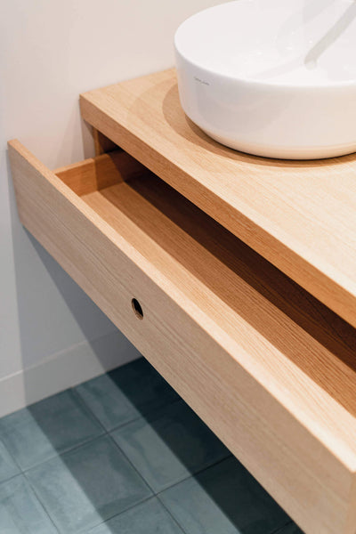 Bathroom sink features sleek drawer. All wood finished with Rubio Monocoat.