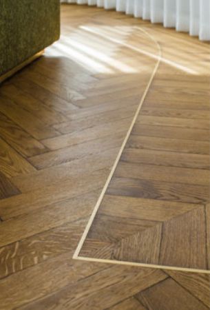 Details of inlay on herringbone floor finished with Rubio Moncoat.