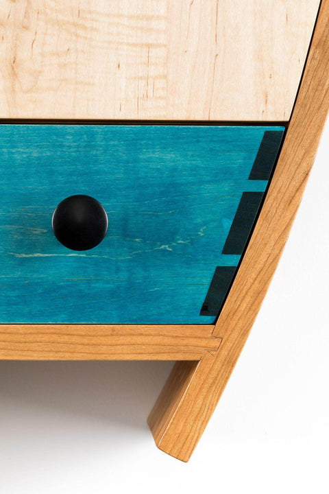 Unique curvy wooden liquor cabinet finished with Rubio Monocoat Oil Plus 2C.