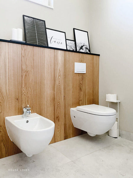 Bathroom with oak wood behind toilet.