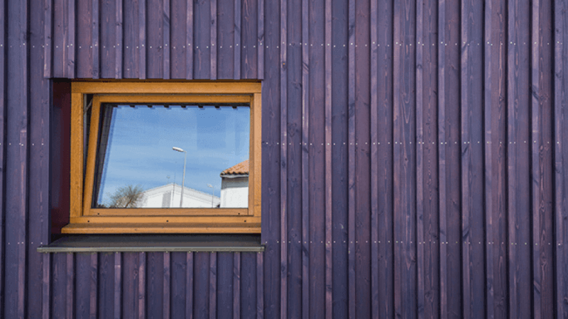 A purple exterior wood wall finished with Rubio Monocoat exterior wood finish.