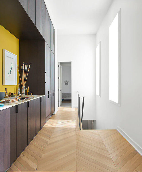 Hallway with chevron white oak floors finished with Rubio Monocoat products.