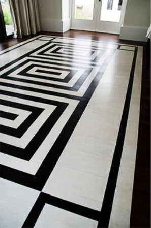 Close up of walnut wood stained and finished with a black and white patterned design.