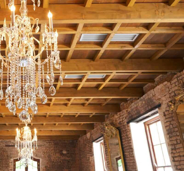 Crossing ceiling beams in natural wood color.