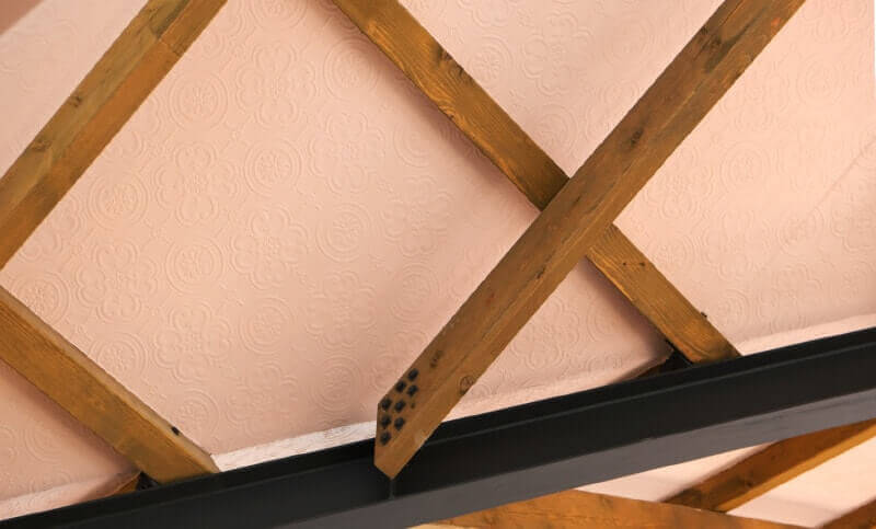 Crossing ceiling joists.