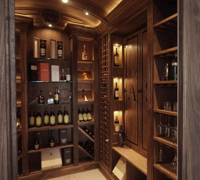 Large walk in liquor cabinet made from walnut wood.