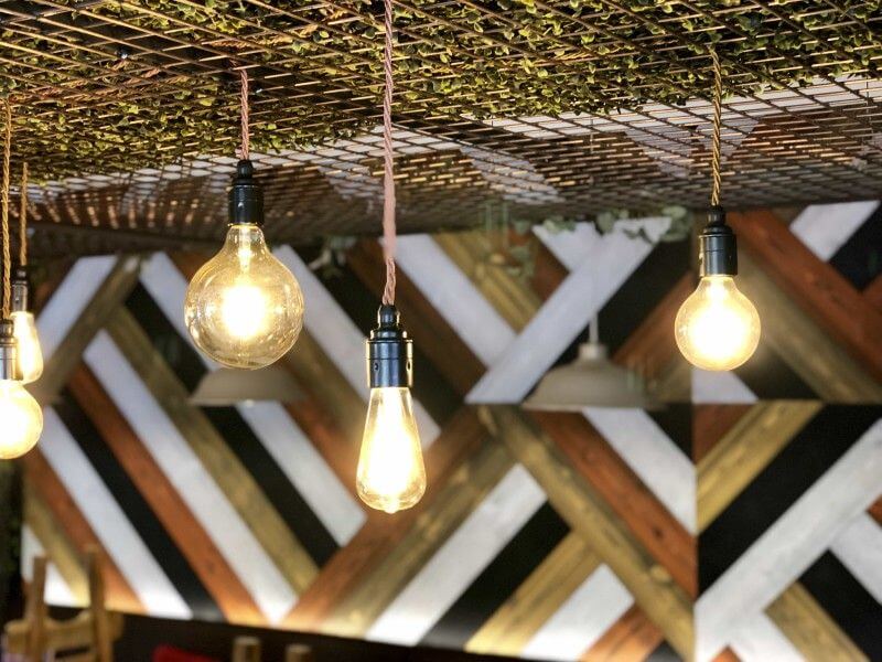 Unique cafe features wood wall finished with Rubio Monocoat.