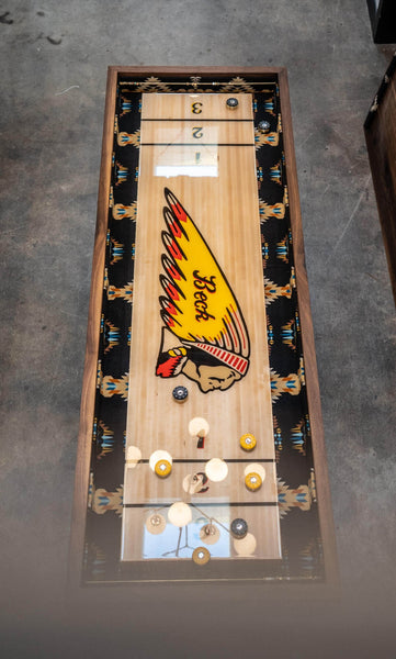 Overhead view of a walnut shuffleboard table finished with Oil Plus 2C hardwax oil.
