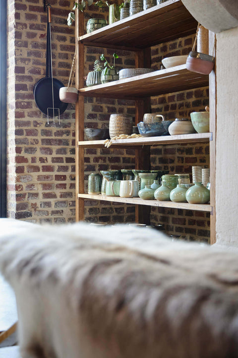 Custom rustic wood retail display for a handcrafted ceramic pot maker.