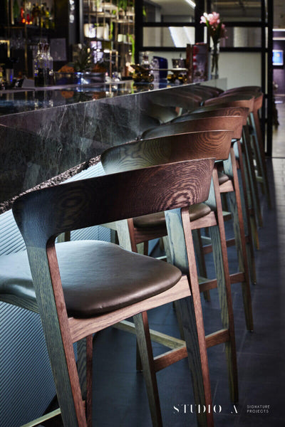 Wooden chairs at bar finished with Rubio Monocoat.