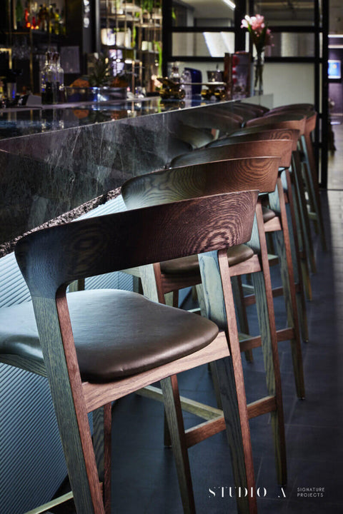 Wooden chairs at bar finished with Rubio Monocoat.