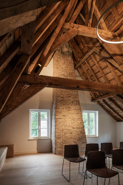 Show stopping exposed beams in a room with old woof floors that were recently refinished with Oil Plus 2C.
