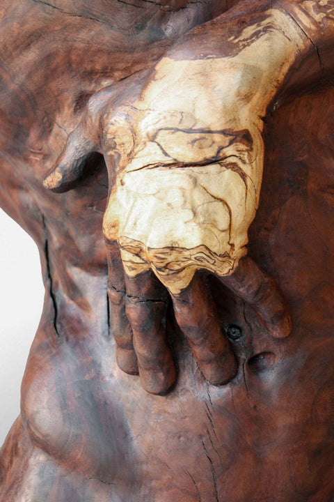 Beautiful detail of hand on wooden sculpture finished with Rubio Monocoat.
