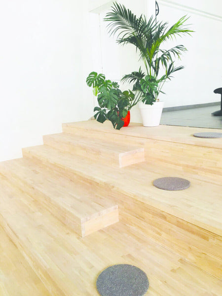 Wood steps in a classroom for sitting on.